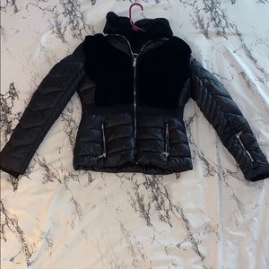 Black fur coat with inside fur collar.